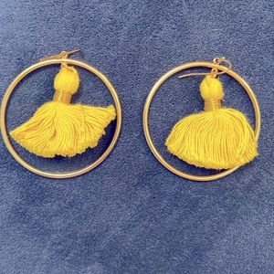 Gold hoop earrings with yellow tassels